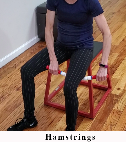 Seated trigger point release using The Stick on the hamstrings.